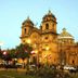 Hotel Choquequirao in Cusco near a historic cathedral at dusk with lit plaza and trees
