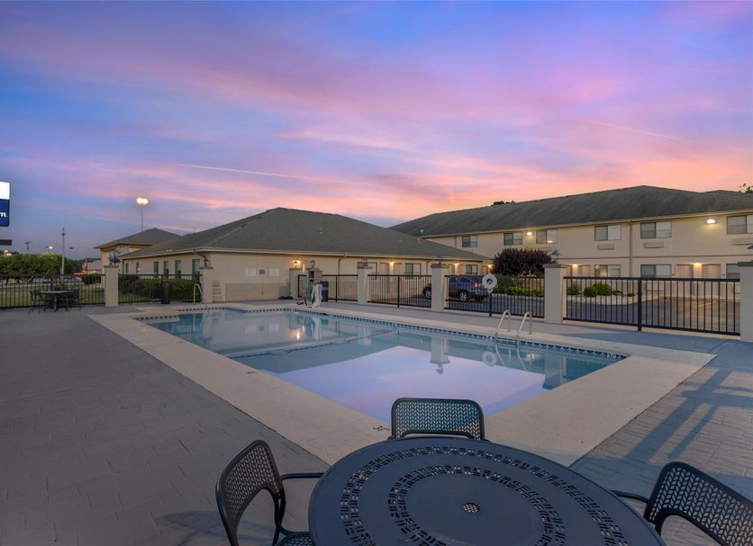 Best Western Timberridge Inn in Grove with outdoor pool at sunset and motel-style exterior