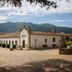 Hotel Rural Casa de Samaioes in Chaves, white rural hotel with cobblestone courtyard and mountain views