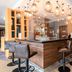 Premier Inn Stuttgart Airport bar lounge with high stools and hanging globe lights in Leinfelden-Echterdingen