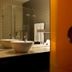 Bad Bubendorf Design & Lifestyle Hotel, Bubendorf bathroom with double sinks and glass shower