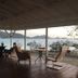 Green Roof Inn in Carriacou with a shaded waterfront deck and chairs overlooking the sea