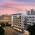 Hanting Hotel Harbin Train Station Branch in Harbin exterior at sunset with city skyline