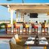 Juweira Boutique Hotel in Salalah, adults-only beachfront bar with stools and ocean view