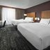Four Points by Sheraton Kansas City Airport guest room with two beds and large window in Kansas City