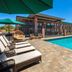 Poolside lounge chairs and outdoor pool at Kokopelli Inn Sedona, Trademark Collection by Wyndham