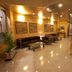 La City Estación Alicante lobby with reception desk, seating area, and polished tile floor
