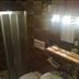 Borcanela Apartments in Moena bathroom with shower, toilet, sink and lit mirror