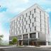Rest Hotel in Gimpo exterior with modern white facade on a street corner