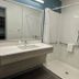 Woodspring Suites Morrisville - Raleigh Durham Airport bathroom with walk-in shower and vanity