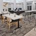Hilton Garden Inn Birmingham SE/Liberty Park dining area with tables, bar stools and patterned carpet