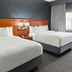Courtyard by Marriott Nashville Brentwood guest room with two beds and window with city view