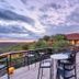Gondwana Etosha Safari Lodge in Okaukuejo with a wooden deck terrace and sunset views