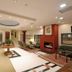 Agriani Hotel in Xánthi lobby with seating area, staircase, fireplace, and elevator