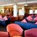 The Riviera Hotel & Apartments - Alum Chine lounge bar in Bournemouth with sofas, armchairs and reception desk