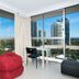 Sunbird Beach Resort Main Beach room with floor-to-ceiling windows and city and ocean views