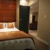 1109 The Decks at 67 Long Street in Cape Town, cozy bedroom with double bed and brown bedding