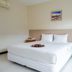 Phangan Island View - Sha Extra Plus guest room with double bed, bedside table and air conditioner in Ko Pha Ngan