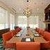 Hilton Garden Inn Winchester meeting room with long conference table, orange chairs and fireplace