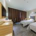 City Comfort Inn Foshan Zumiao Zhangcha twin guest room in Foshan with two beds and desk