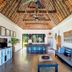 Paradise Cove Resort, Naukacuvu Island: airy lounge with thatched ceiling, pool table, and seating area