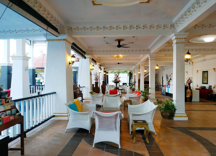 Sari Pacifica Resort & Spa, Redang Island open-air resort lounge with white chairs and columns