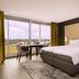 Van Der Valk Hotel Ara in Zwijndrecht guest room with king bed, desk, and balcony view