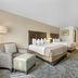 Best Western Black Hills Lodge in Spearfish: guest room with two beds, armchair, desk, and patterned carpet
