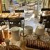 Hotel Amerique in Palavas-les-Flots breakfast buffet with pastries, cereal jars and dining tables by the patio