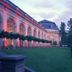 Schloss Hotel Dresden Pillnitz in Dresden, illuminated historic hotel facade with arched windows and lawn
