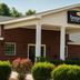 Boarders Inn & Suites by Cobblestone Hotels - Ashland City exterior with brick facade and white columns