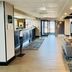 Quality Inn Danville - University Area lobby with seating area, front desk and glass entrance in Danville