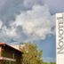 Novotel Campo Grande in Campo Grande with stormy clouds over the hotel roof and tropical trees