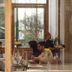 Krista Boutique Hotel Buenos Aires restaurant with guests dining beside large glass windows
