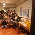 Guesthouse Tomaru in Takayama group photo of guests in a common room with table and chairs