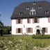 Malteser Komturei Hotel / Restaurant in Bergisch Gladbach, white historic hotel with dark steep roof
