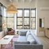 Woodstock Way Hotel in Woodstock, bright suite with floor-to-ceiling windows, sofa and woven pendant light