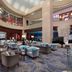 Beijing Marriott Hotel Northeast lobby lounge in Beijing with curved ceiling, seating area, and bar