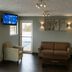 Boarders Inn & Suites by Cobblestone Hotels - Ashland City lobby with seating and wall-mounted TV