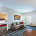 TownePlace Suites by Marriott Tulsa North/Owasso suite with sofa, desk, and separate bedroom in Owasso