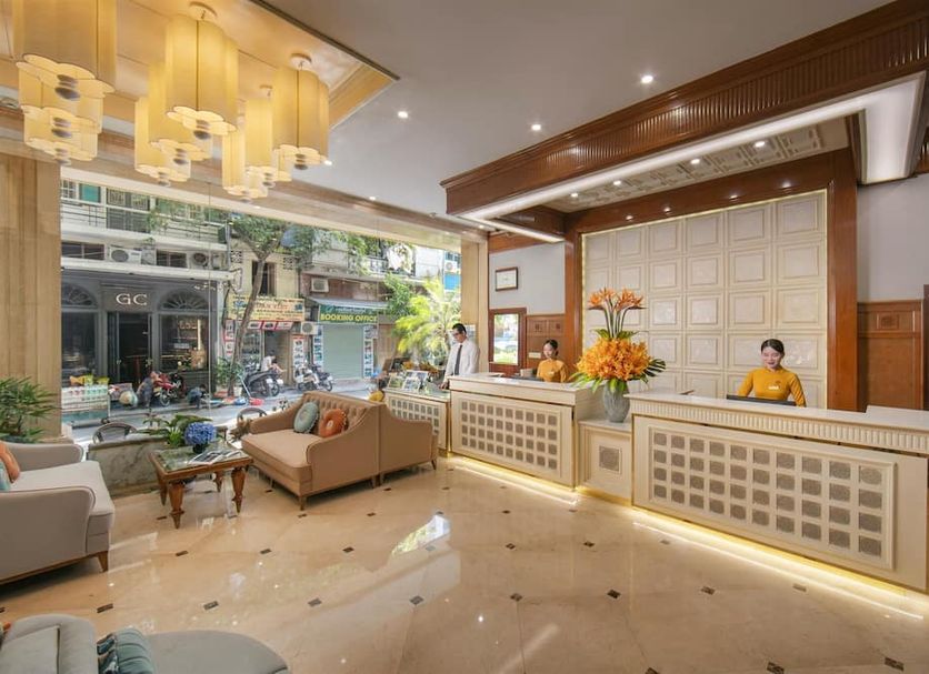 Hanoi Pearl Hotel Hanoi lobby with front desk, seating area and street view through windows
