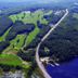 Aerial view of The Poland Spring Resort in Poland with golf course, wooded grounds, and nearby water