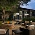 Courtyard by Marriott Dallas-Fort Worth/Bedford courtyard with fire pit and outdoor seating at dusk