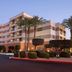 Courtyard by Marriott Scottsdale Old Town exterior at dusk with palm trees and modern facade in Scottsdale