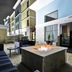Homewood Suites by Hilton New Braunfels outdoor fire pit seating area beside the hotel