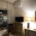 Panorama Junior Suites in Kavála with harbor view from a room, TV, chair, and bedside lamp
