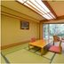 Nikko Yumoto Onsen Honokana Yado Jurin in Nikkō, tatami room with low table and garden view