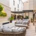 Aurea Catedral by Eurostars Hotel Company Granada courtyard lounge with outdoor seating and glass walls