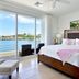 Coral Beach Club Villas & Marina guest room with king bed and ocean-view balcony in Upper Prince's Quarter