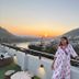 Bunk Stay Co-Working And Yoga rooftop terrace in Rishikesh at sunset with mountain and river views